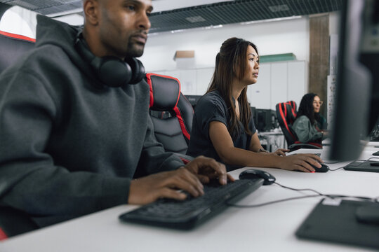 Computer game developer programming in a workspace