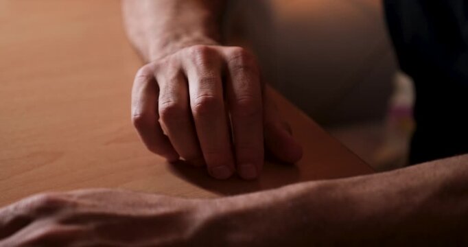 Bored Man Playing with Coin in His Hand, Fidgeting and Idle Time Concept