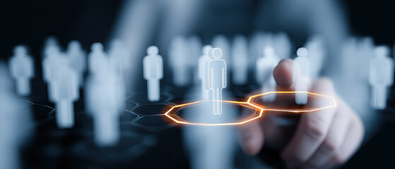 Finger selects highlighted person icon among digital workforce silhouettes.