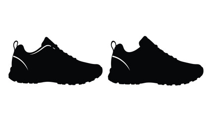 Black running shoes displayed in a striking dark silhouette © Hiron
