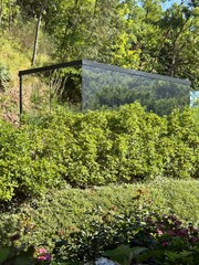 Glass-Walled Modern Structure Hidden Among Tuscan Greenery