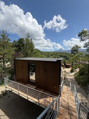 Modern Cabin on Stilts with Walkway in Tuscan Countryside