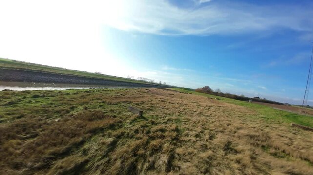 Fast FPV Drone View Over Foss Dyke River Drain in UK, Cinematic Low Altitude Flight Near Bridge Piers and Pumping Station Sluice Gates 4K