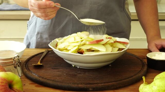 Woman makes an apple pie
