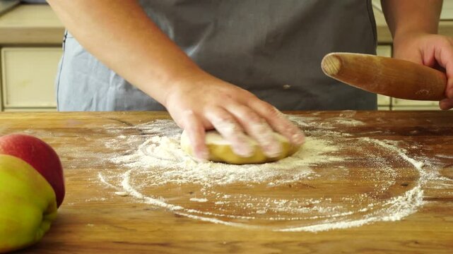 Woman makes an apple pie
