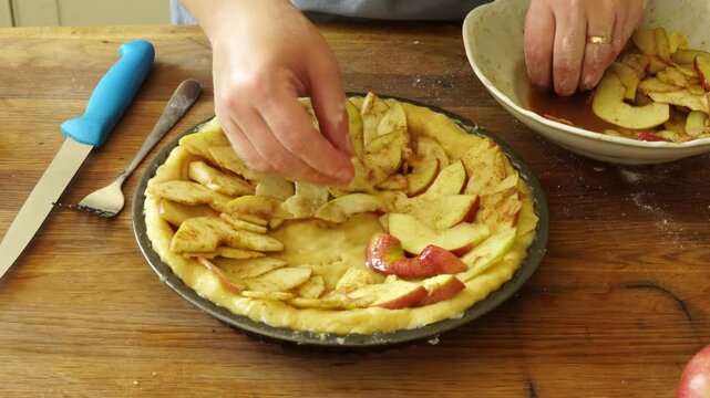 Woman makes an apple pie
