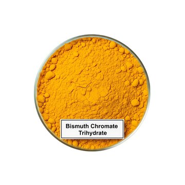 A circular container filled with yellow bismuth chromate trihydrate powder, viewed from directly above, showcasing the texture and details of the chemical substance