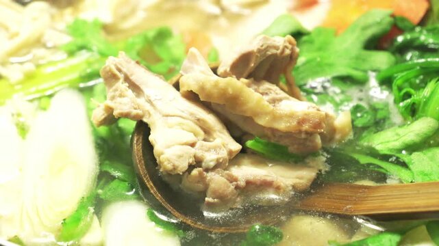 Japanese Hot Pot Cooking in Winter &ndash; Steaming Nabemono with Vegetables and Fish Close-Up
