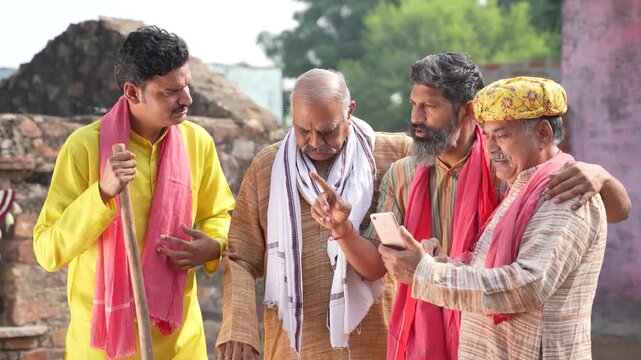 indian farmer group using smartphone and 