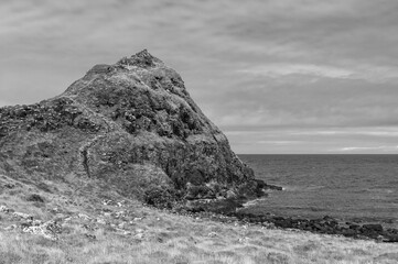 A rocky hillside overlooking the ocean
