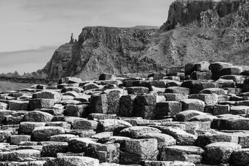 A rocky hillside with a mountain in the background