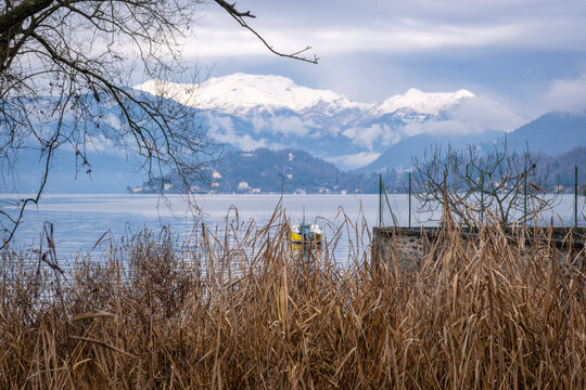 Panorama of the Lake Orta winter waters and shoreline, with the alps in the background. Is a glacial origin lake in northern Italy, Piedmont region, famous for San Giulio island, home of nuns cloister