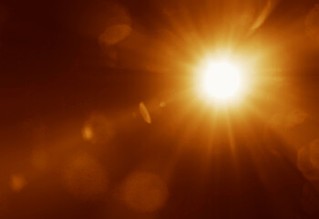 Obraz premium shiny sun rays burst, sunbeams, sunrays, sunshine sunburst design. Yellow warm light effect, sunny beams, yellow orange red golden sunshine isolated on black background. star dust sun light shine