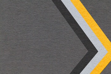 Fototapeta premium Dark gray paper texture background with yellow black chevron stripes and copy space for banner, presentation, template