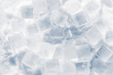 Ice cubes on a bright white snow background.