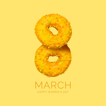Creative card for March 8th. Two yellow donuts in the shape of number eight on yellow background. Greetings for International Women's Day. Minimalistic layout with food. Sweet delicious donuts