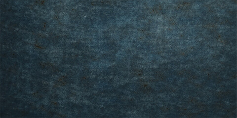 A dark blue denim fabric texture displays a rough macro pattern of vintage cotton textile material with a grunge surface design suitable for a fashion clothing backdrop