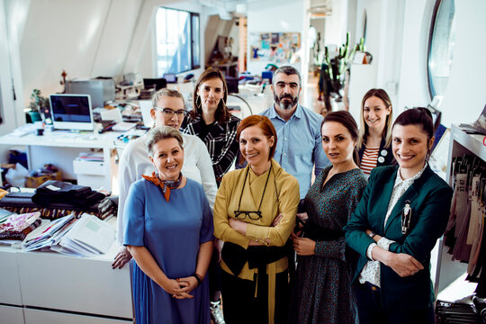 Group of coworkers smiling in modern creative office