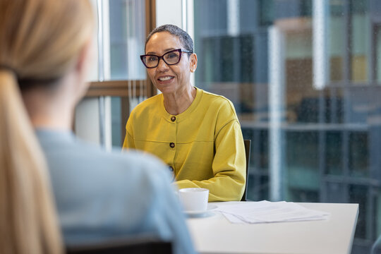 Senior businesswoman listening in a business meeting