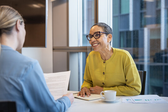 Financial advisor assisting client in a meeting