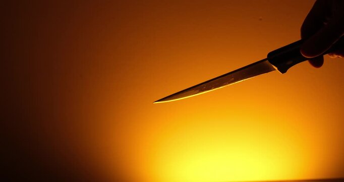 Menacing Man Holding Large Knife, Danger and Crime Concept
