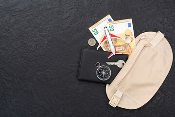 Traveler organizer bag with passport and accessories on concrete background, top view