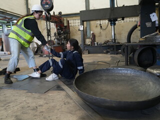 Accident at work of construction worker at site. Safety team helps employee accident.