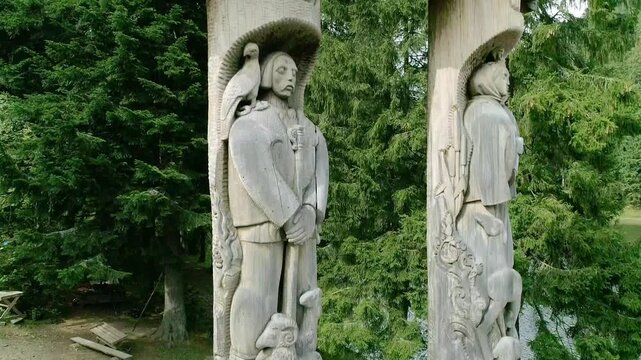 Iconic wooden sculptures of Syn the count's daughter with blue eyes and shepherd Vir playing flute. Eternal lovers legend from Ukrainian Carpathians folklore captured September 16 2017