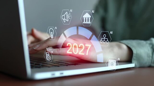 Future trends in technology and artificial intelligence projected for 2027 with hands typing on a laptop.