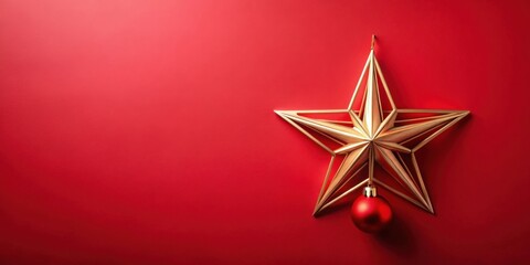 A Festive Gold Star Ornament with a Red Bauble on a Crimson Background, Ideal for Holiday Greetings and Celebrations
