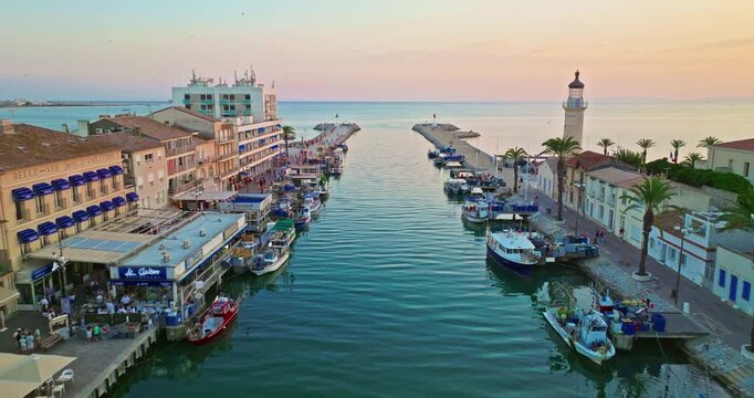 Aerial view of the Grau du Roi fishing village at sunrise in Camargue, a resort on the coast of Occitanie region in France. Beautiful coast town Grau du Roi in southern France