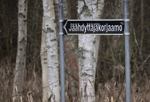 Long Finnish place name J&auml;&auml;hdytt&auml;j&auml;korjaamo with 19 letters on a road sign, near Heinola, Finland