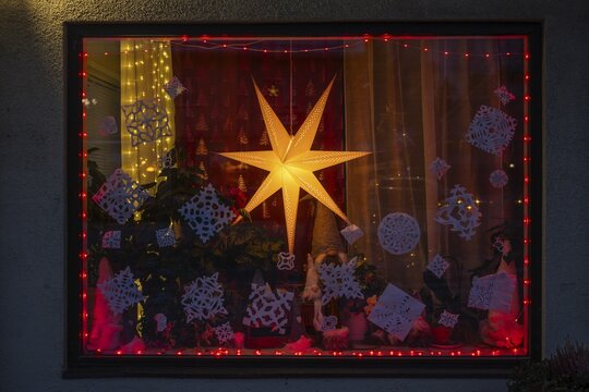 Christmas decorated and illuminated shop window with Christmas stars and fairy lights, Sysm&auml;, Finland