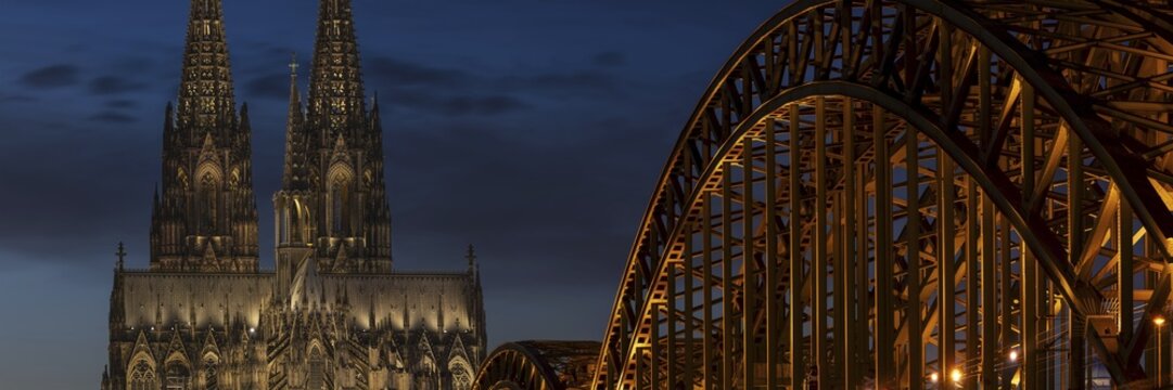 Evening atmosphere, Cologne Cathedral illuminated with LED lamps and the Hohenzollern Bridge, Cologne, North Rhine-Westphalia, Germany