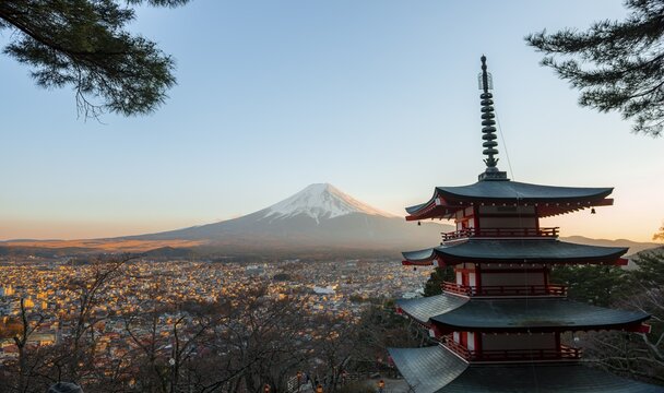 Five-story pagoda of a Shinto Shrine, Chureito Pagoda, with views of Fujiyoshida City and Mount Fuji volcano at sunset, Arakura Fuji Sengen Shrine, Arakurayama Sengen Park, Yamanashi Prefecture, Japan