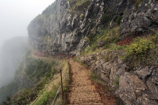 Hiking trail PR1 Vereda do Areeiro in the fog, from Pico do Arieiro to Pico Ruivo, Madeira, Portugal