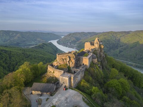 Drone shot of Aggstein Ruin at sunrise with Danube, Wachau, Sch&ouml;nb&uuml;hel-Aggsbach, Lower Austria, Austria