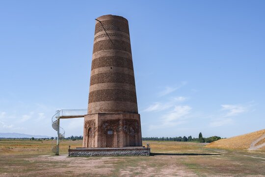 Burana Tower, remains of Karakhanid Minaret, histroic ancient city of Balasagun on the Silk Road, Balbals, historic tombstones in the shape of human faces, near Tokmok, Chuy, Kyrgyzstan