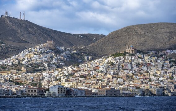 View of the town of Ermoupoli, on the hill the Basilica of San Giorgio in Ano Syros, and Anastasi Church or Church of the Resurrection, Syros, Cyclades, Greece