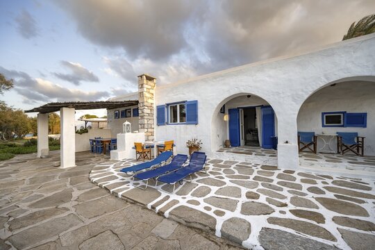 White Cycladic house with terrace with chairs and sun loungers, Holiday home, Parikia, Paros, Cyclades, Greece
