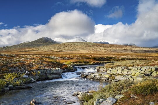 Autumnal mountain landscape with river Store Ula, Rondane National Park, Norway