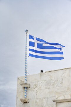 Greek flag, flag waving in the wind, Panagia Tourliani Monastery, Ano Mera, Mykonos, Cyclades, Greece