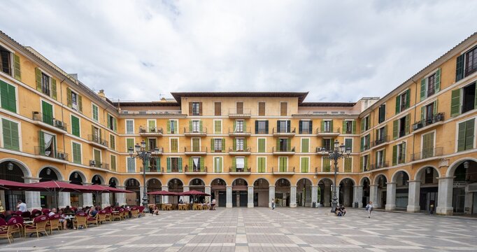Yellow fa&ccedil;ade with arcades, Pla&ccedil;a Major, Palma de Majorca, Majorca, Balearic Islands, Spain