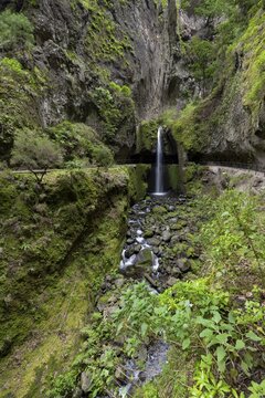 Nova waterfall and Moinho in a gorge, hiking trail at Levada Nova, long exposure, Ponta do Sol, Madeira, Portugal