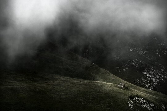 Mountain hut on mountain meadow with remains of fog, stream, Lechtal, Tyrol, Austria