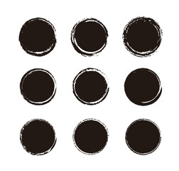 Set of black grunge circle brush strokes with rough textures. Hand-drawn ink round frames and blobs, perfect for rustic labels, artistic stamps, vintage logos, and creative paint designs.