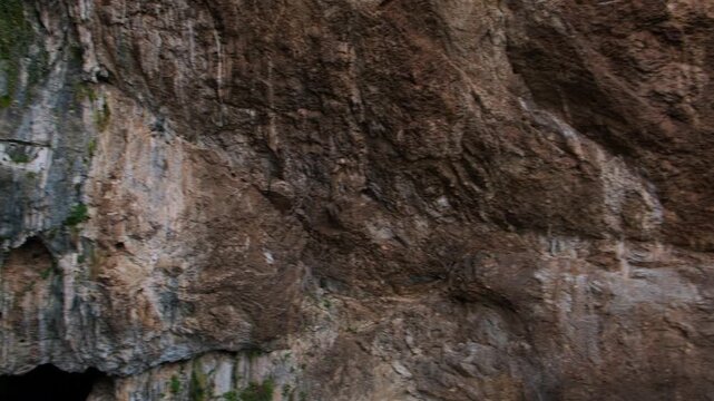 Handheld panning footage of The Blagaj Tekke, historic Sufi monastery and dervish house built on the cliffs by the Buna river in Mostar, Bosnia and Herzegovina