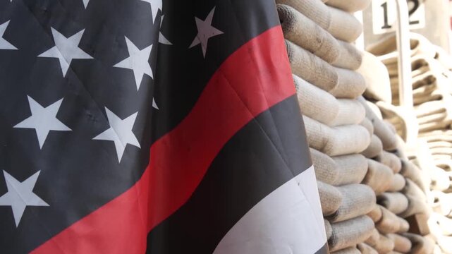 Red thin line black american flag on firefighter truck. Hose of firetruck and fire fighters symbol in New York, United States. 911 remembrance, fire department engine vehicle. September 11 Patriot Day