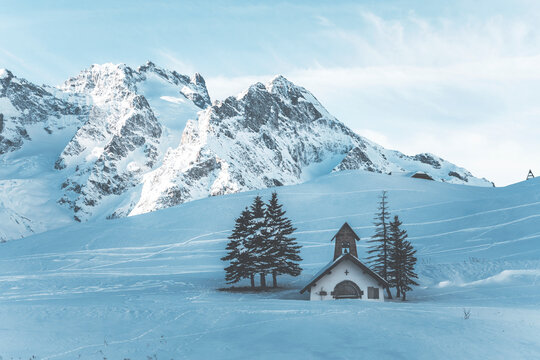 alpine chapel in a snow covered landscape at col de lautaret in french alps