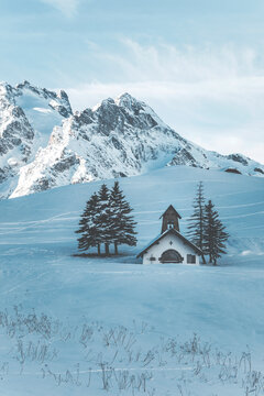 small church in a snow covered landscape at col de lautaret in french alps